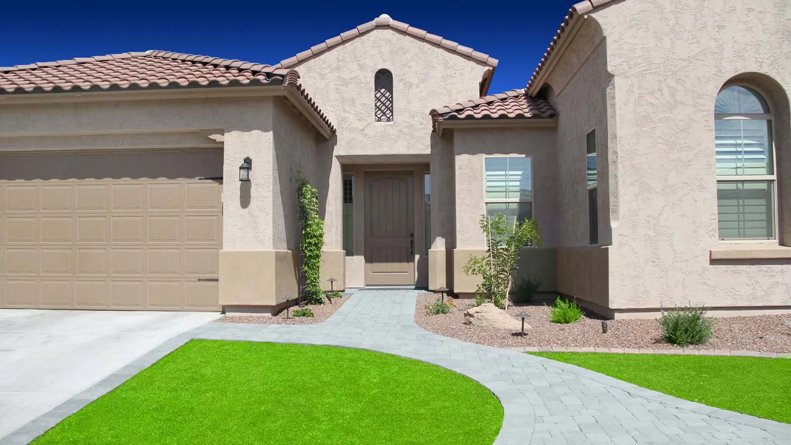 Stucco home with a tile roof in Arizona