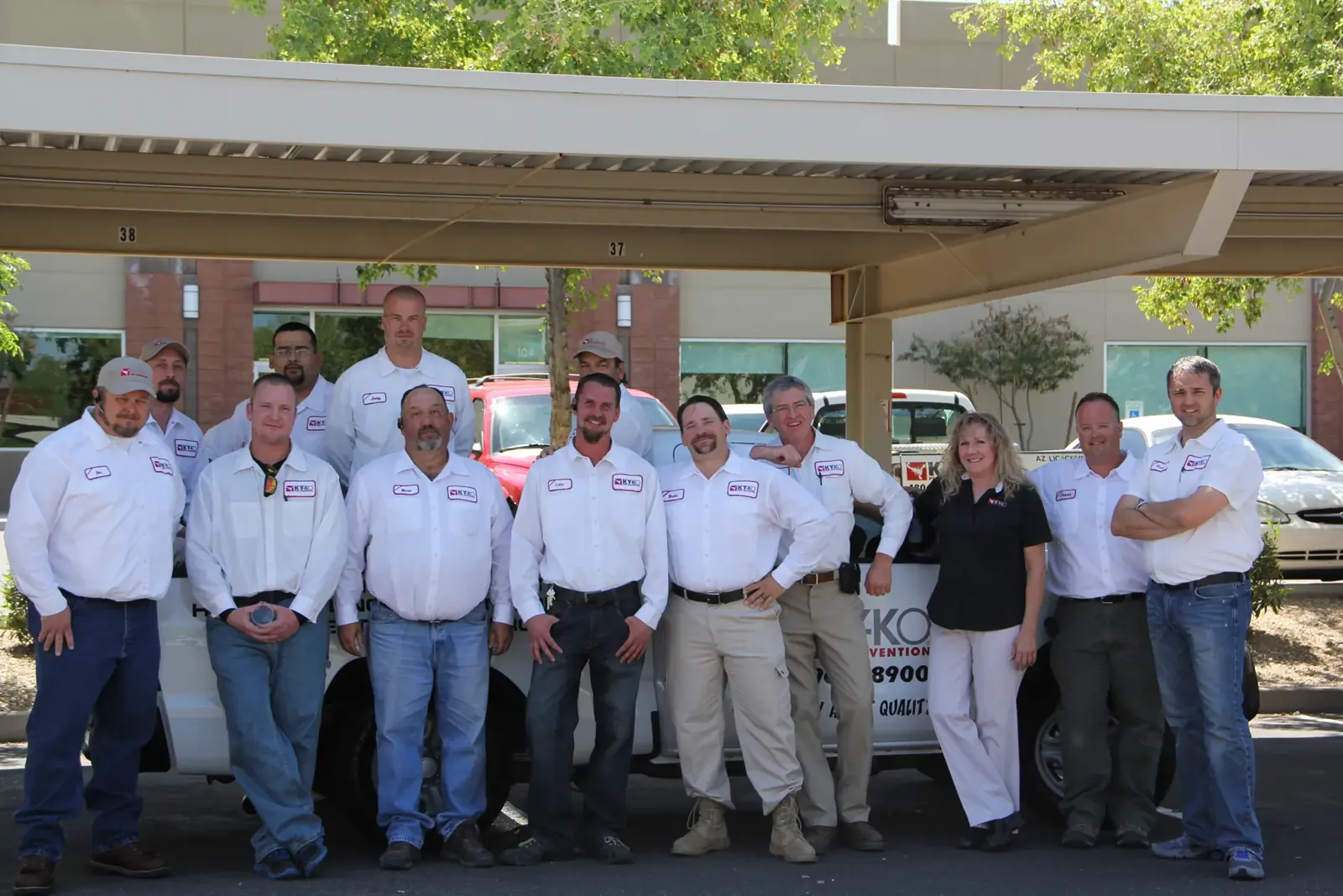 The KY-KO Pest Prevention team in front of their service trucks