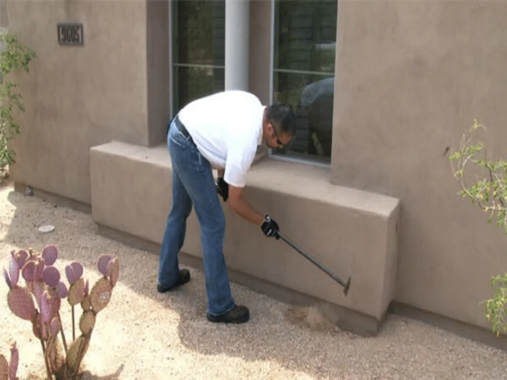Termite treatment along a stucco foundation