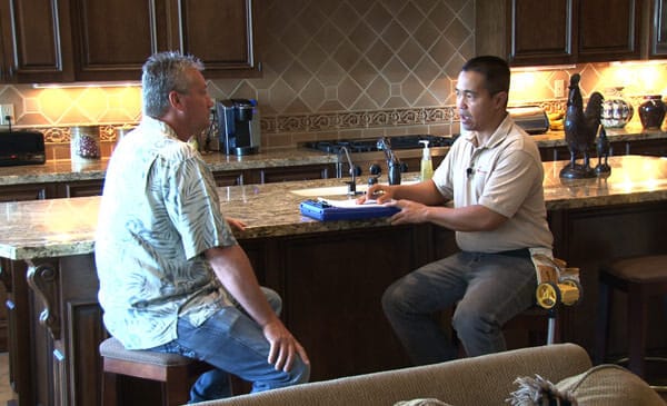 A KY-KO Pest technician sits down with this local homeowner to review the results of their recent termite inspection.