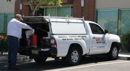 A KY-KO Pest technician loads up their truck before heading out to help a local client.