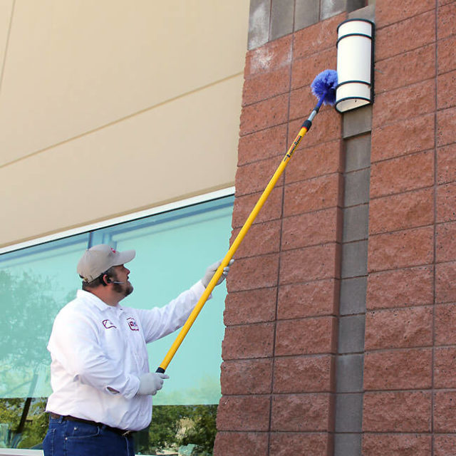 One of our experienced techs finishes a commercial pest control inspection for this Scottsdale business.